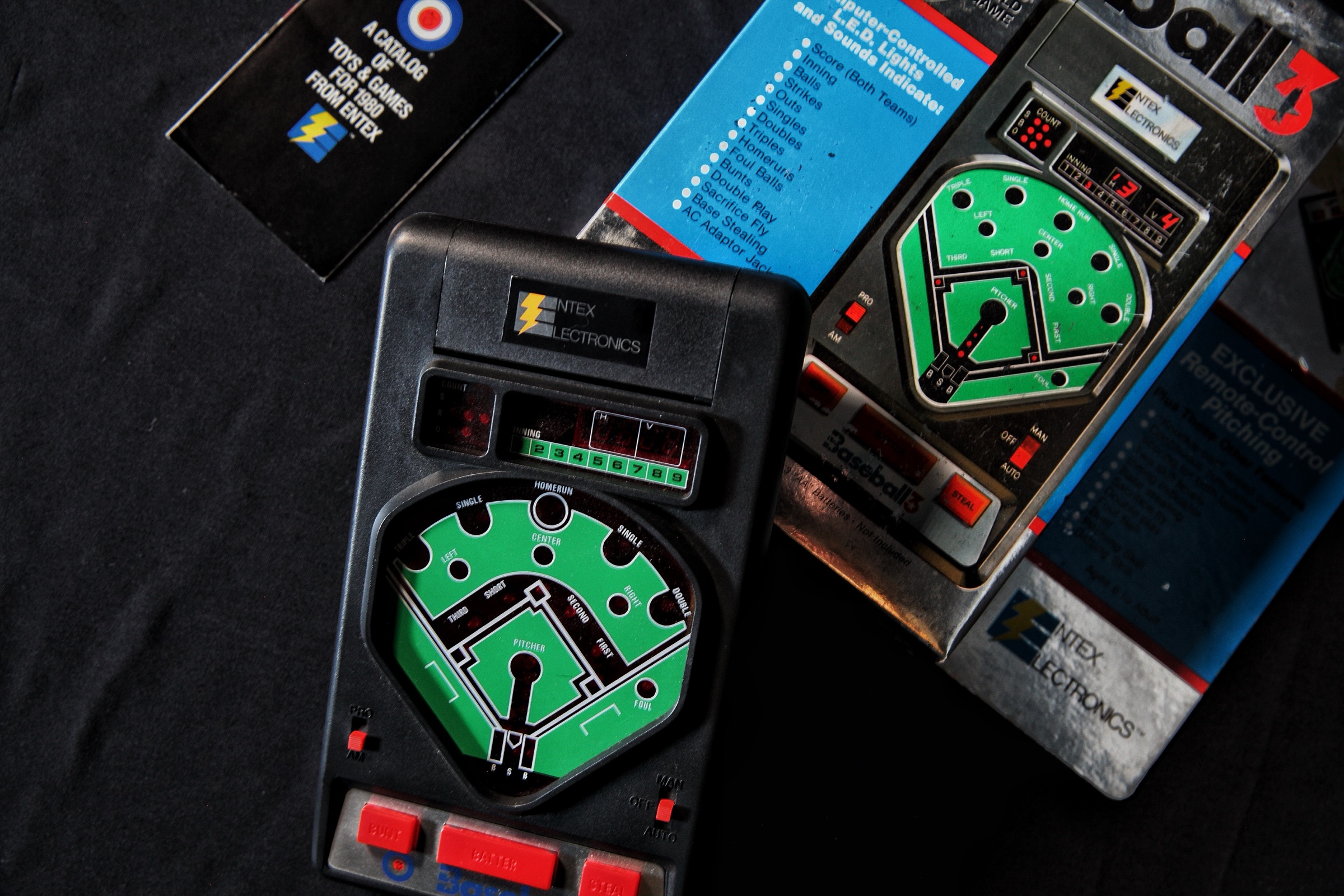 Entex Baseball 3 handheld LED game with its original box and Entex's 1980 toy catalog